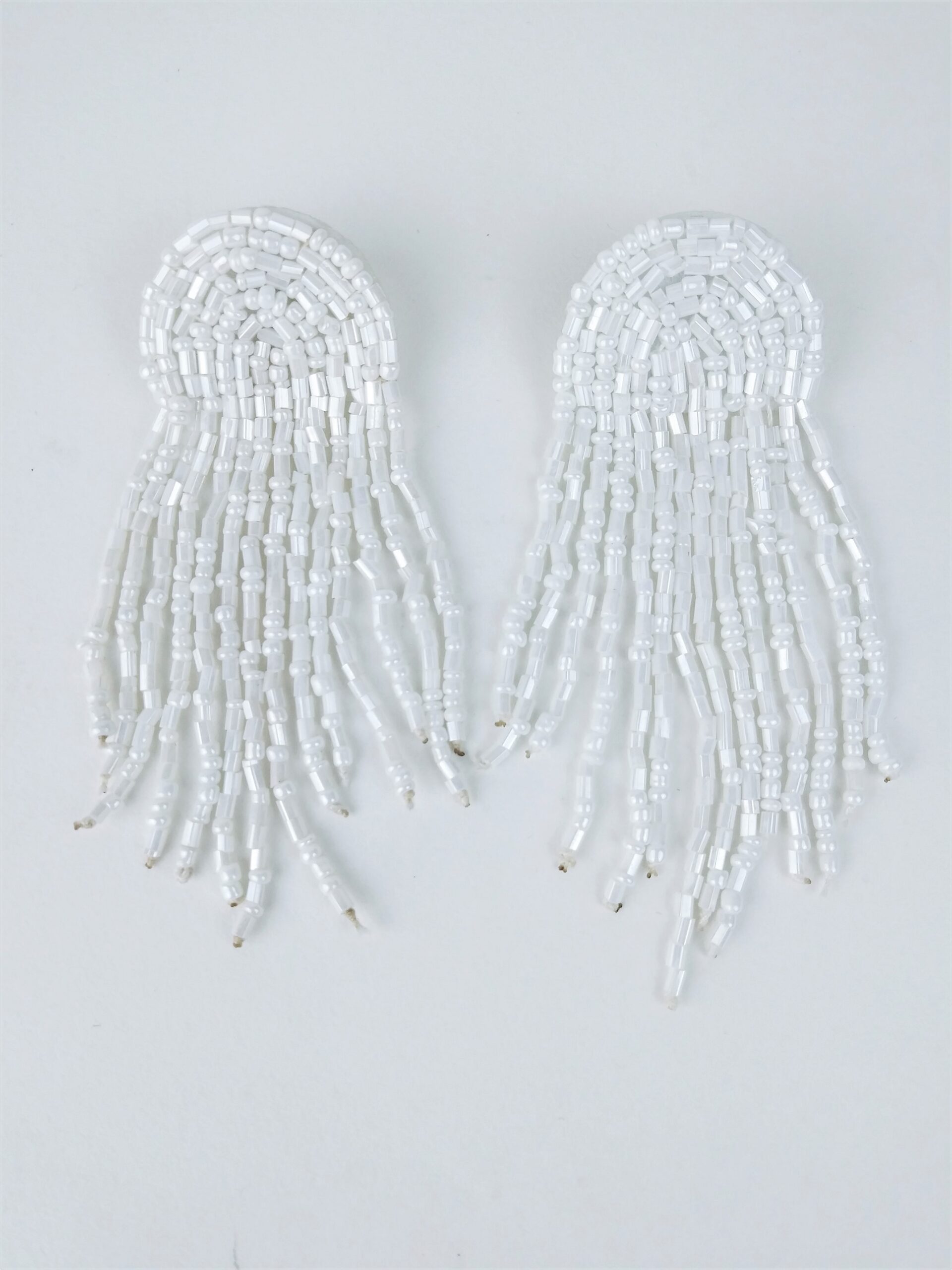 arch white beaded fringe earrings